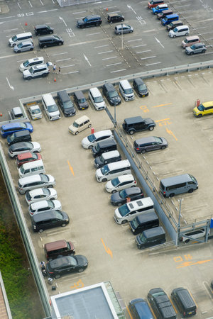 Aerial view of parking lot with cars and trucks at the airportの写真素材