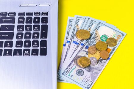 Money earned on freelance on a yellow backgroundの写真素材