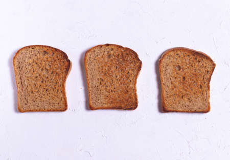 Crispy toasted bread for toast on white backgroundの写真素材