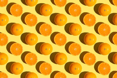 Seamless orange christmas pattern made from cut and whole tangerines