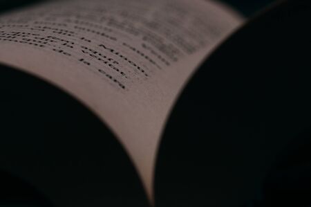 Book pages close up. Macro photography in warm colors is suitable as a background on the topics of reading, literature, book business, book publishing.の写真素材