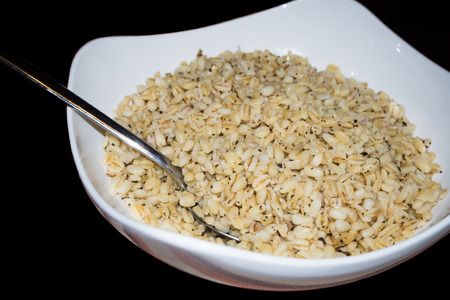 Puffed wheat bowl on black backgroundの写真素材