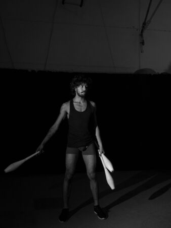 Young juggler making a performance at the circusの写真素材