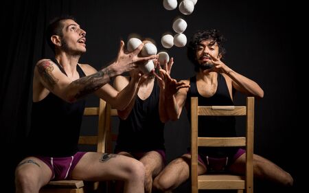 Comedy actors and jugglers having fun during their show at the circusの写真素材