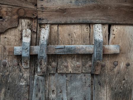 Rustic and old wooden gate backgroundの写真素材