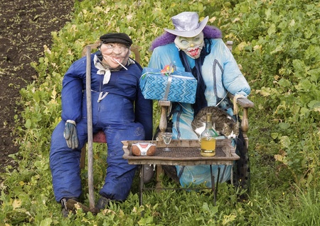 Two scarecrows placed in an orchard, a funny scene.の写真素材