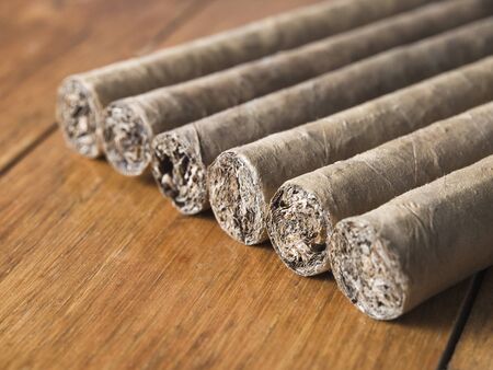 Cuban cigars closeup in a row