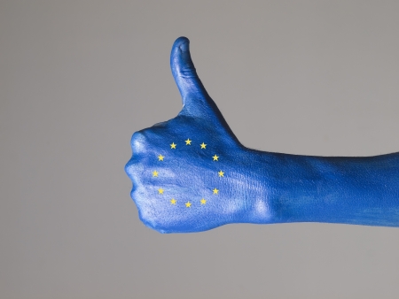 Hand painted with the flag of European Community,  expressing positivity and isolated on gray...