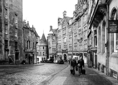 EDINBURGH, SCOTLAND-JANUARY 20  Black and white urban scene in Edinburgh, Scotland, on January 20, 2012  In the photo we can see a street of Edinburgh with two people in the foregroundのeditorial素材