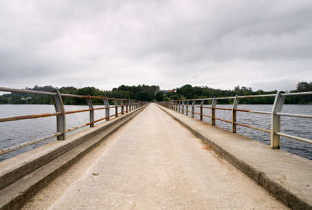 Bridge in a swamp with symmetrical composition  This swamp is located in Cecebre, Coruna, Galicia, Spain の写真素材