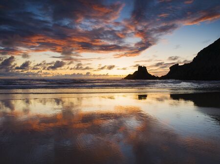 Beautiful sunset in a spanish beach  The photo is taken in Campelo beach, Galicia, Spain, in a beautiful and multicolored sunset の写真素材