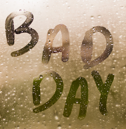 Text "BAD DAY" written in a crystal with many drops.の写真素材
