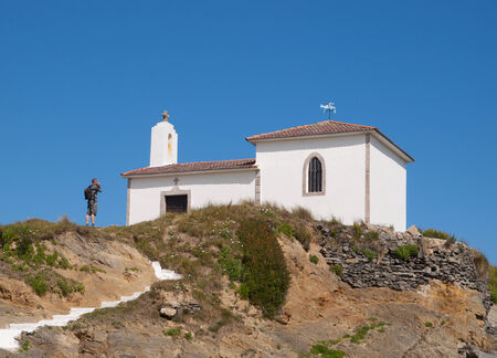 Little chapel and man in Valdovino, Galicia, Spain.の写真素材