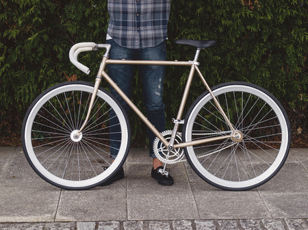 Fixie bike detail in autumn outdoors in a boardwalk