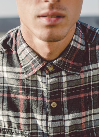 Plaid shirt detail in the neck of a manの写真素材