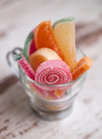 jelly beans in a glass cup in a macro shot.の写真素材