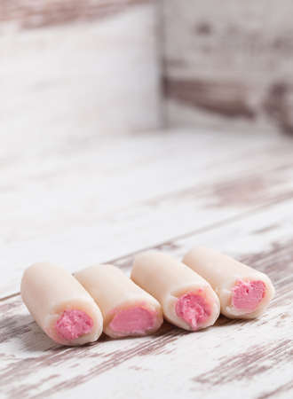 "Holy bones" on wooden background. "Holy bones" is a typical dessert in Spain.の写真素材