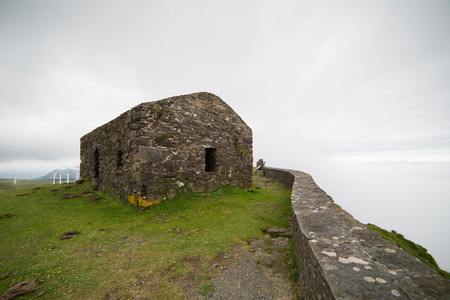 Cliffs in "Garita Herbeira" in a foggy day.These are one of the most highest cliffs in Europe. The name of the small construction is "Garita Herbeira"の写真素材