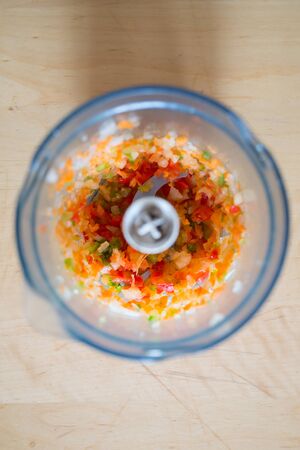 Chopped ingredients in a bowl in a photo from aboveの写真素材