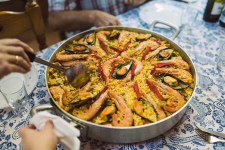 Typical spanish seafood paella in traditional panの写真素材
