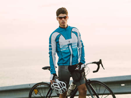 Cyclist portrait outdoors, he is looking at camera.の写真素材