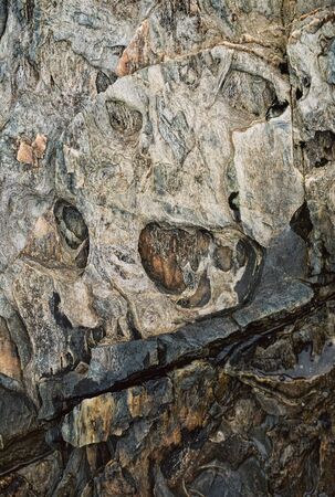 Skull face background in the rock outdoors