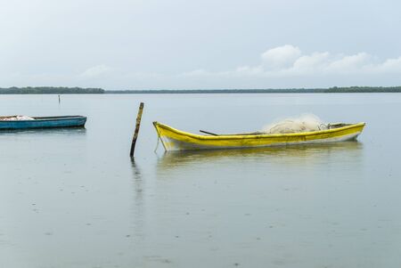 With Their Boats tied nets on the beachの写真素材