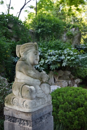 The sculpture of the god in a park in Shanghai, Chinaの写真素材