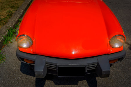 Red vintage car parked on the streetの写真素材