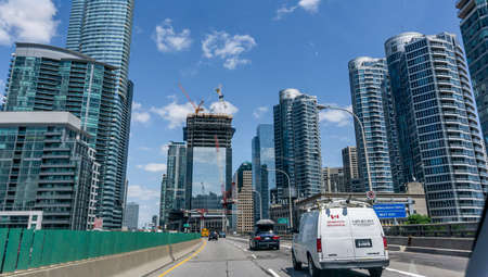 Expressway with sparse traffic along the tall buildings in downtown Toronto, canadaのeditorial素材
