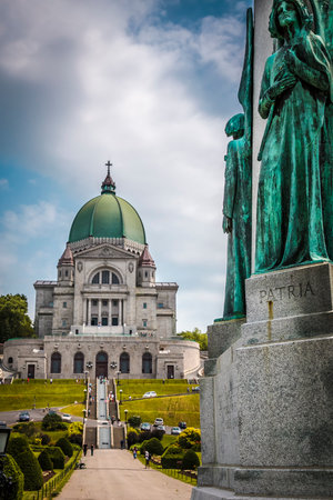 Statues of divinities in front of historic St Joseph Oratory at Montreal, Quebec, Canadaの写真素材