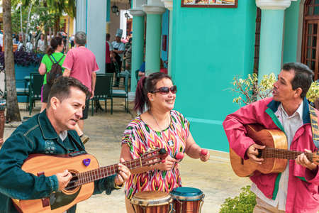 Street musicians performing outside a restaurant in a tourist area of Cayo Santa Maria, Cuba