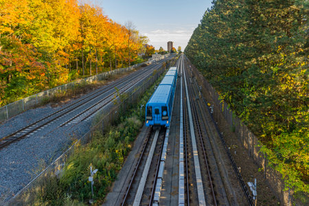 Blue SRT train passing through the countryside of Scarborough, Ontario, Canadaのeditorial素材