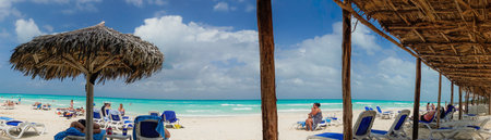 Cayo Santa Clara, Cuba - Tourists enjoying the paradisiac beach under beach hutsのeditorial素材