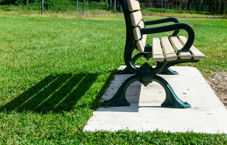 Bench with shadow in a parkの写真素材