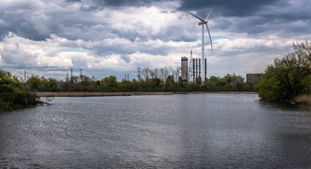 Windmill viewed across the lakeの写真素材