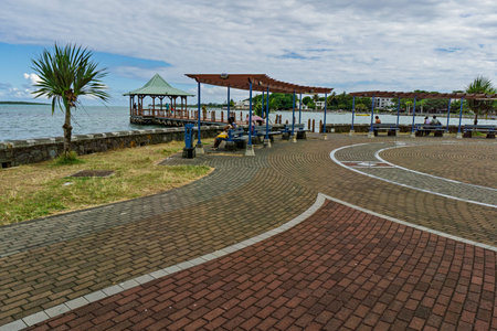Waterfront promenade with curved brick stone walkwayのeditorial素材