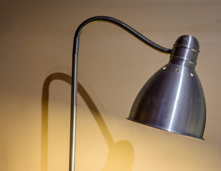 Modern metal table lamp with warm glowの写真素材