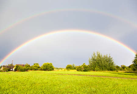 The double rainbow view over Lithuanian countryside の写真素材