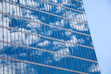 Cloud reflections off the glass skyscraper in the city of Vancouver British Columbia, Canada.