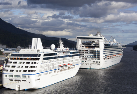 The view of cruise liners docked in Ketchikan with evening sky in a background (Alaska).のeditorial素材