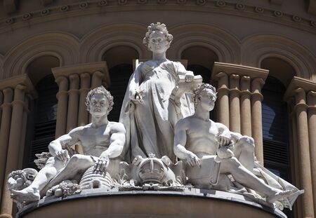 The close view of sculptures on a top of a historic building in Sydney (Australia).の写真素材
