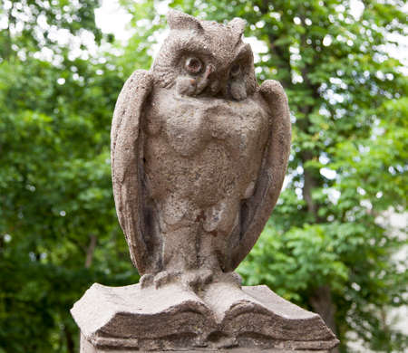 The one of fifty sculptures of owls that surrounds the College of Art in the city of Kaunas (Lithuania).の写真素材