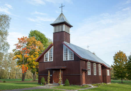 Little wooden church of the village in early Autumn (Lithuania).の写真素材