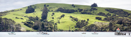 The panoramic view of French Bay in Akaroa resort town (New Zealand).の写真素材