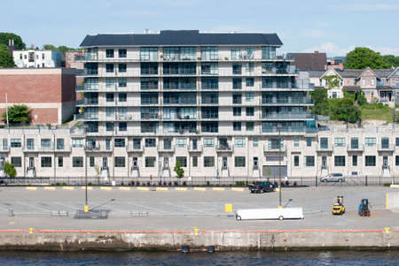 The modern apartment building standing in front of the bay in Saint John town (New Brunswick).の写真素材