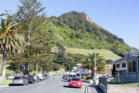 The morning view of The Mall street in Mount Maunganui resort town with Maunganui mountain in a background (Tauranga, New Zealand).の写真素材
