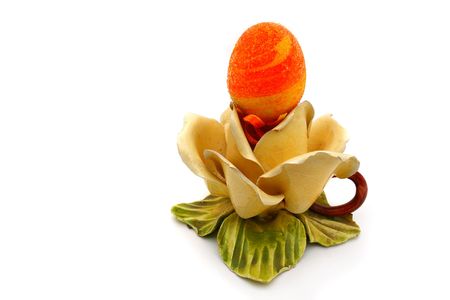 Easter egg on a ceramic base with a white background                               の写真素材