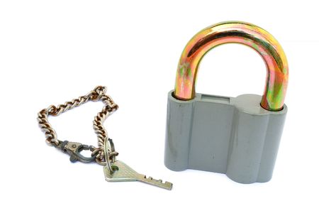 Old padlock with key isolated on white background                                      の写真素材