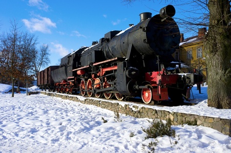 Old fashioned black - red locomotive as a monument  の写真素材